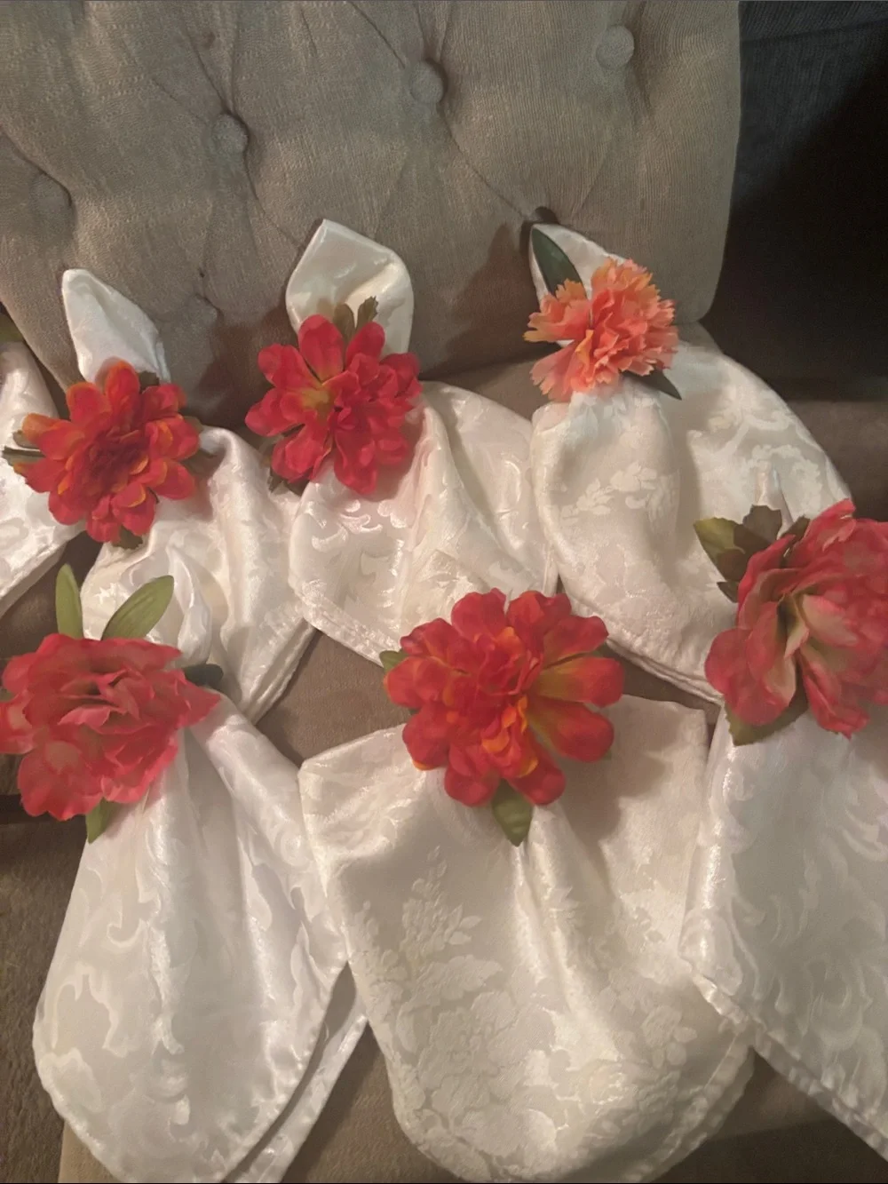Six large easy care white napkins and 6  floral napkin rings.